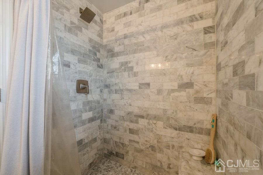 35 Pine Tree Drive Colonia, NJ 07067 - Photo 23 of 39 a bathroom with a shower