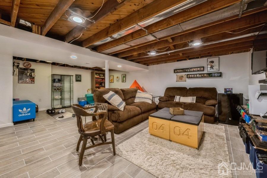 35 Pine Tree Drive Colonia, NJ 07067 - Photo 24 of 39 a living room with furniture and a wooden floor