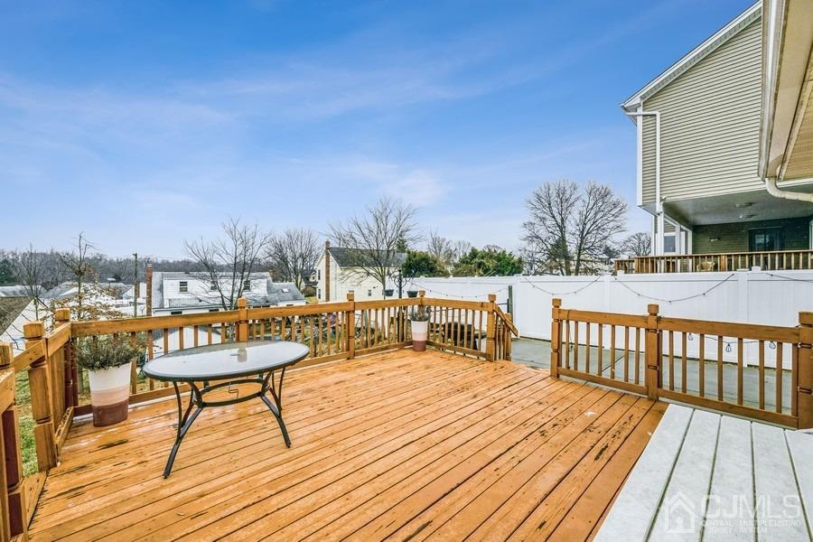 35 Pine Tree Drive Colonia, NJ 07067 - Photo 30 of 39 a balcony with wooden floor and city view
