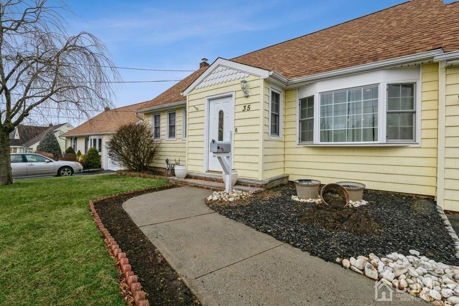 35 Pine Tree Drive Colonia, NJ 07067 - Photo 4 of 39 a front view of a house with garden