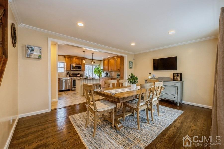 35 Pine Tree Drive Colonia, NJ 07067 - Photo 6 of 39 a view of a dining room with furniture and wooden floor