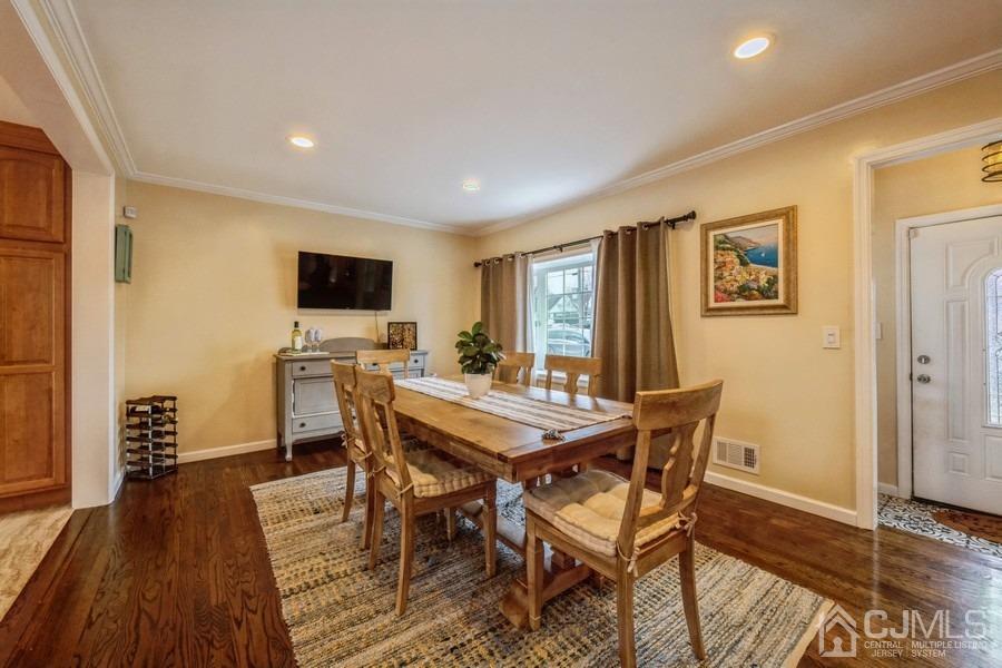 35 Pine Tree Drive Colonia, NJ 07067 - Photo 7 of 39 a view of a dining room with furniture window and wooden floor