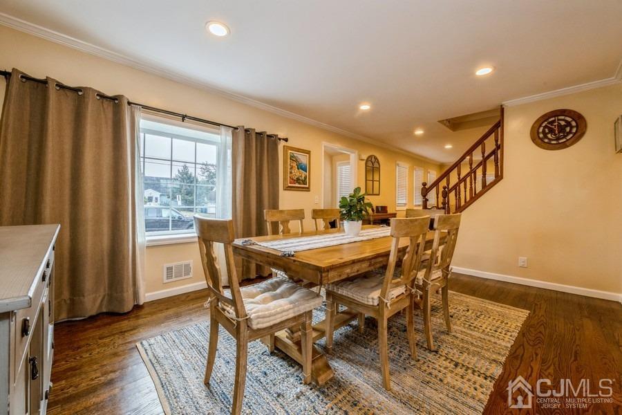 35 Pine Tree Drive Colonia, NJ 07067 - Photo 8 of 39 a view of a dining room with furniture and wooden floor