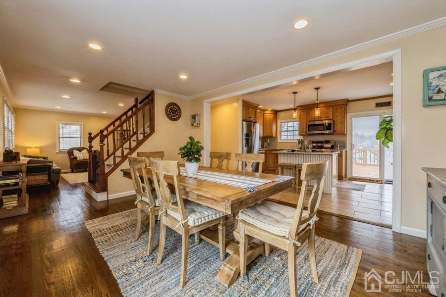 35 Pine Tree Drive Colonia, NJ 07067 - Photo 9 of 39 a dining room with furniture and wooden floor