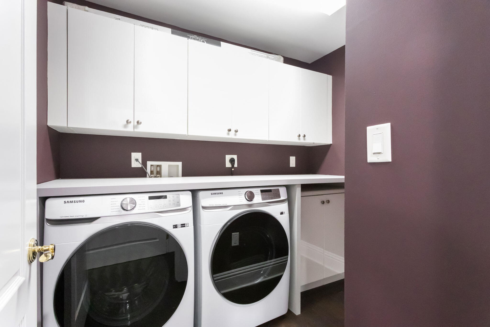 200 East Palmetto Park Road, Unit 10 Boca Raton, FL 33432 - Photo 16 of 47 a view of washer and dryer with kitchen in the background