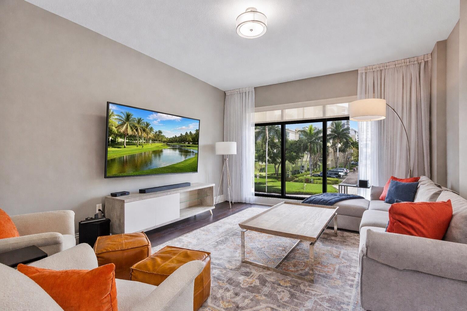 200 East Palmetto Park Road, Unit 10 Boca Raton, FL 33432 - Photo 2 of 47 a living room with furniture and a flat screen tv