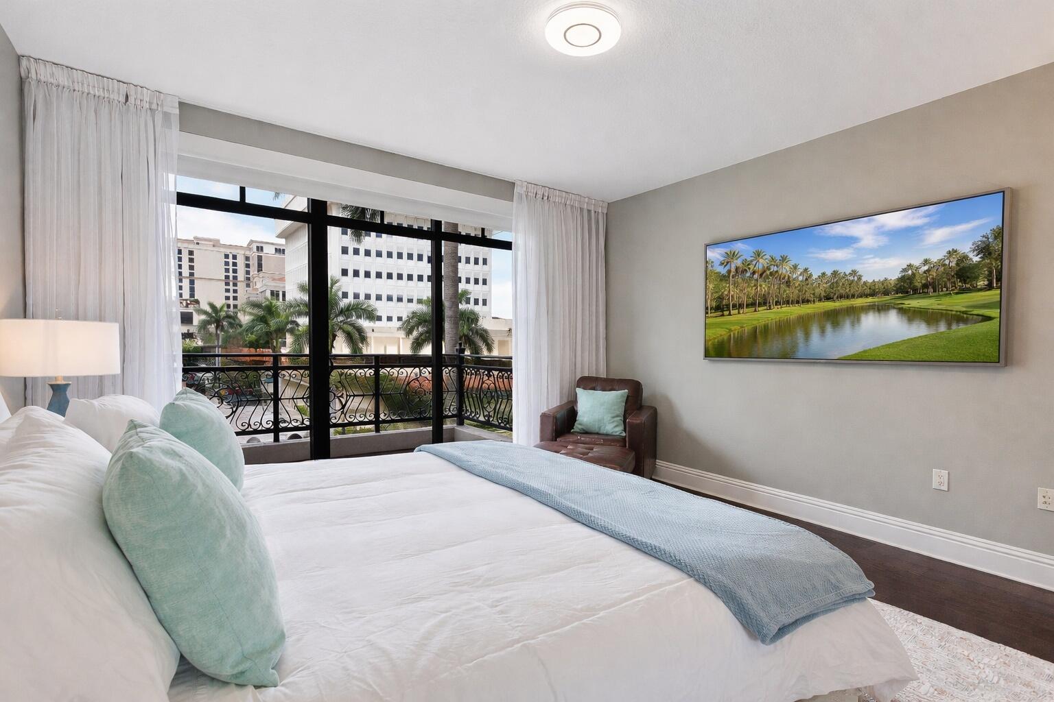 200 East Palmetto Park Road, Unit 10 Boca Raton, FL 33432 - Photo 24 of 47 a bedroom with a large bed and a window
