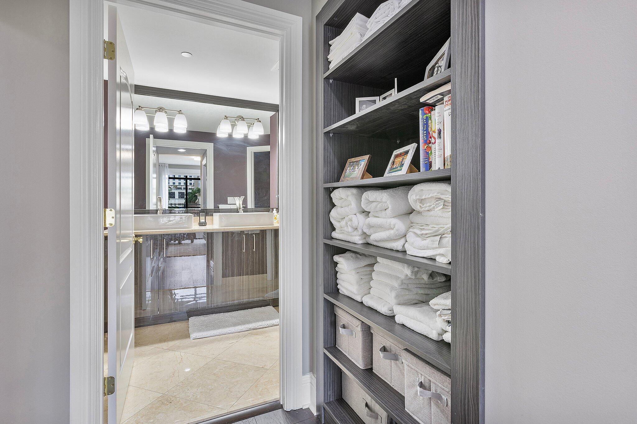 200 East Palmetto Park Road, Unit 10 Boca Raton, FL 33432 - Photo 27 of 47 a view of walk in closet with clothes and shoes