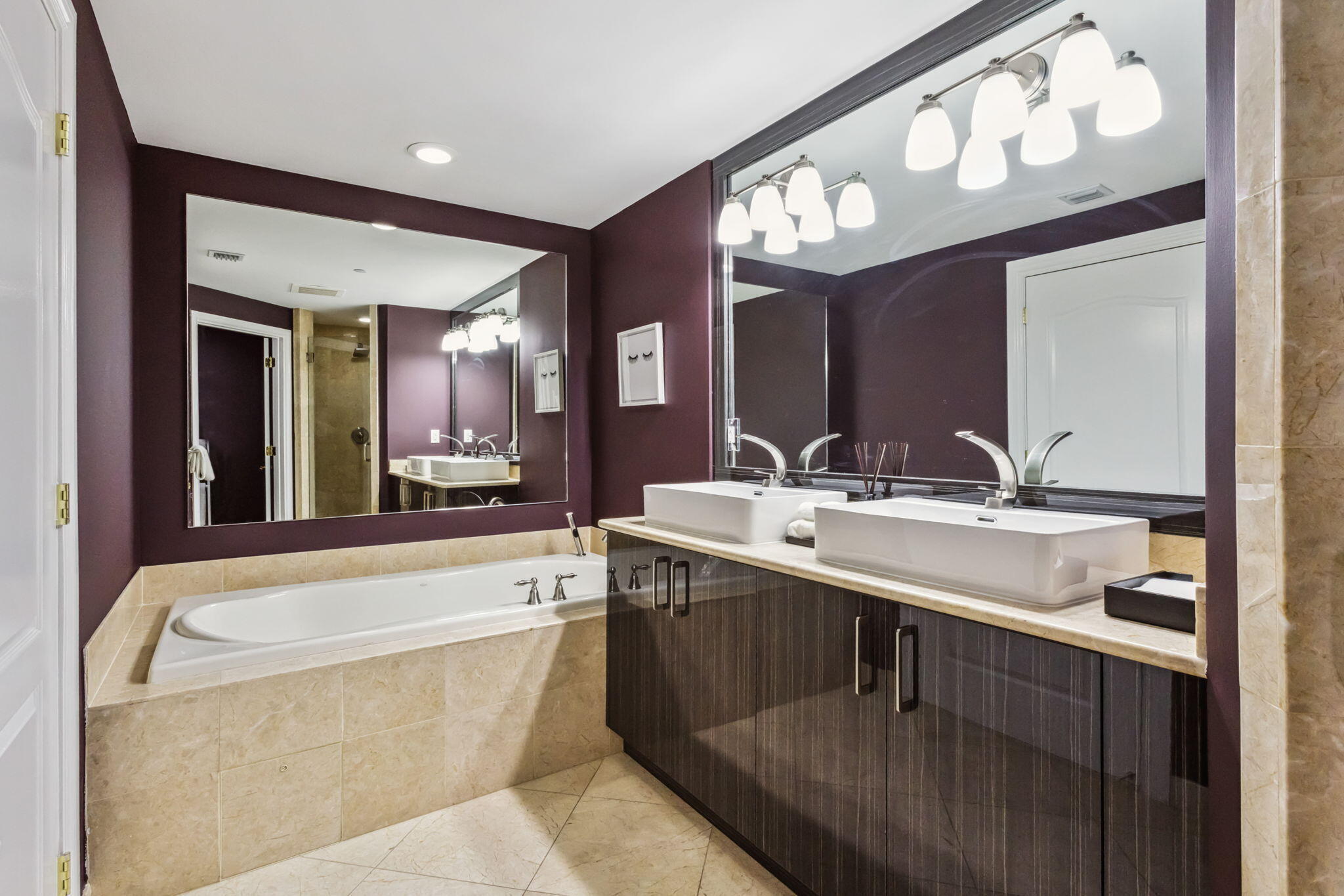 200 East Palmetto Park Road, Unit 10 Boca Raton, FL 33432 - Photo 28 of 47 a bathroom with a sink a large mirror and a bathtub