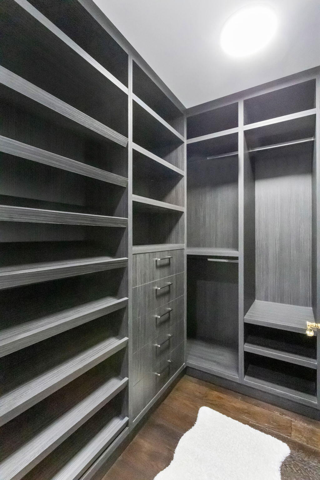200 East Palmetto Park Road, Unit 10 Boca Raton, FL 33432 - Photo 30 of 47 a view of walk in closet with clothes and shoes