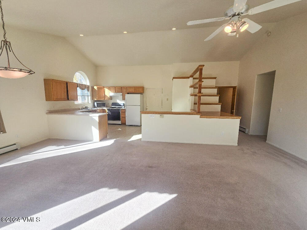 702 Bull Run Eagle, CO 81631 - Photo 11 of 26 a view of a kitchen with furniture and a kitchen
