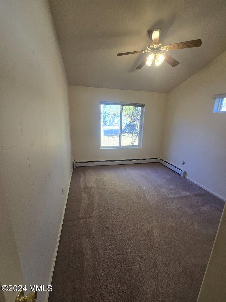 702 Bull Run Eagle, CO 81631 - Photo 14 of 26 an empty room with windows and fan