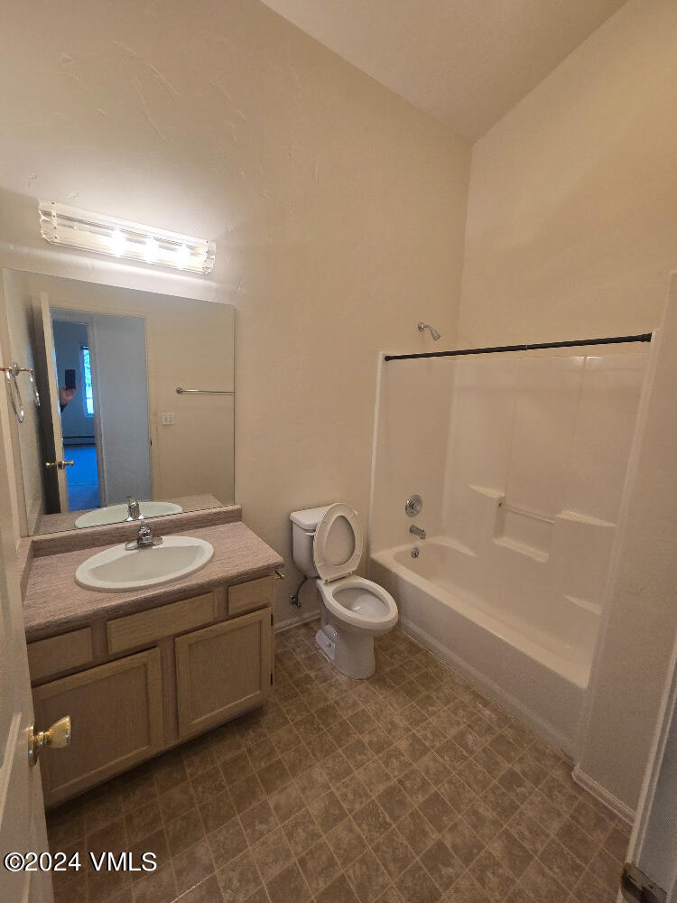 702 Bull Run Eagle, CO 81631 - Photo 15 of 26 a bathroom with a sink a toilet and shower