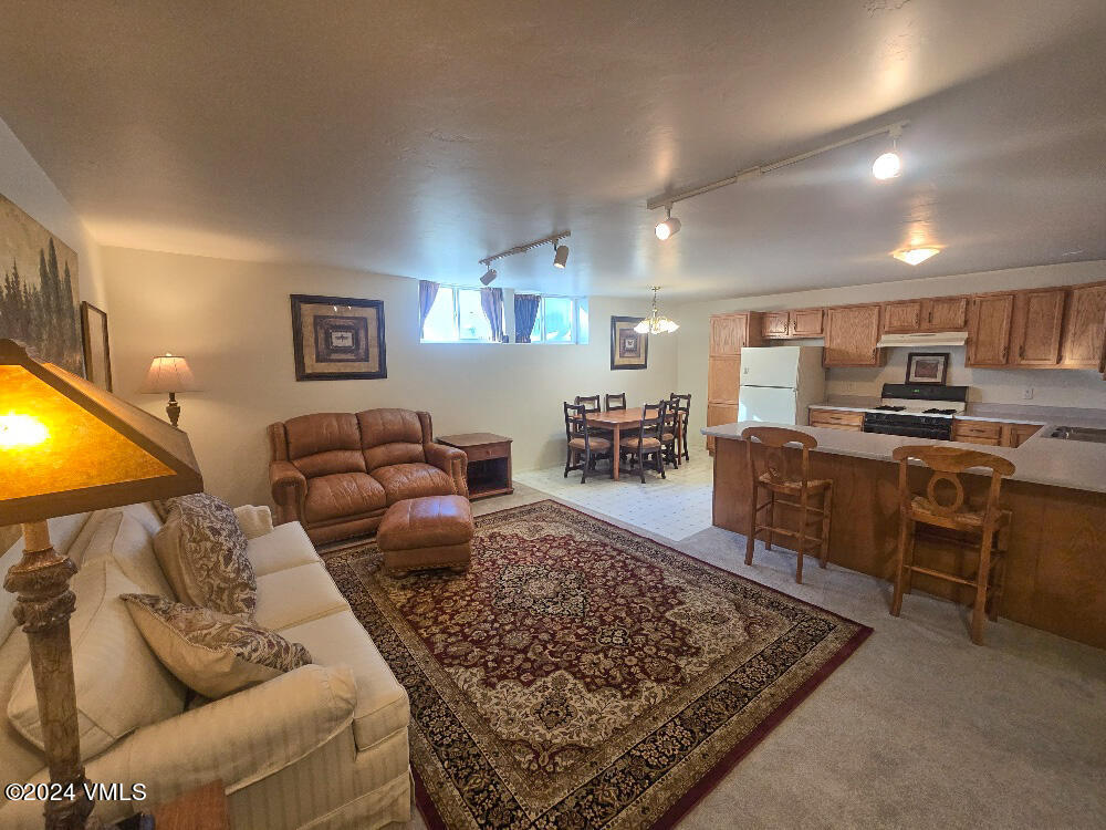 702 Bull Run Eagle, CO 81631 - Photo 20 of 26 a living room with furniture and a rug