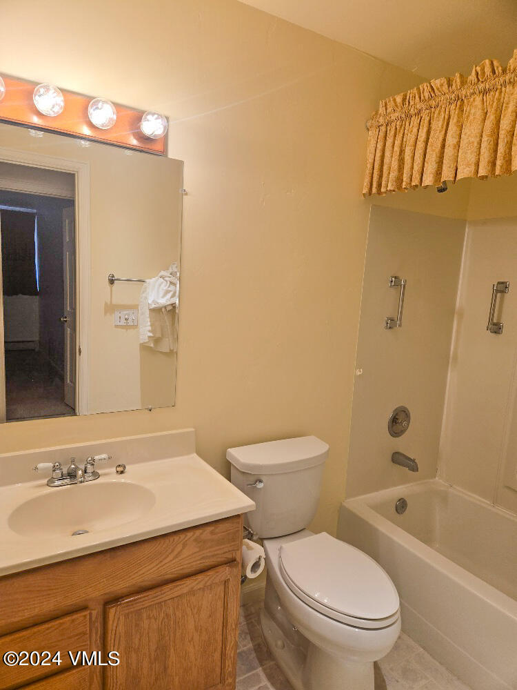 702 Bull Run Eagle, CO 81631 - Photo 25 of 26 a bathroom with a sink a toilet and shower