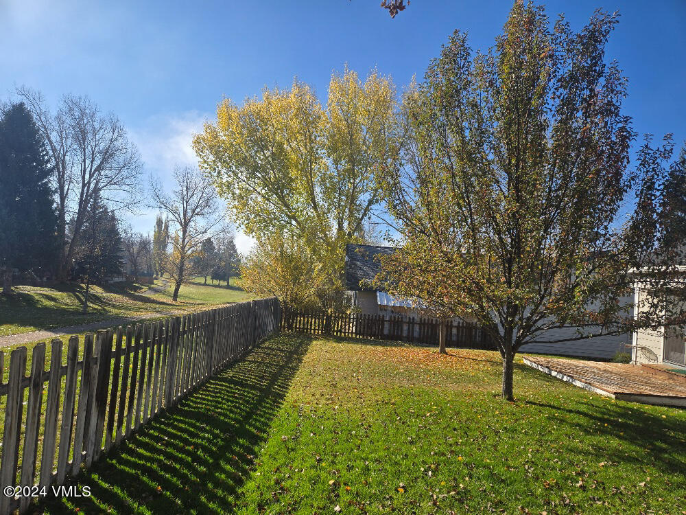 702 Bull Run Eagle, CO 81631 - Photo 5 of 26 a view of a backyard with wooden fence