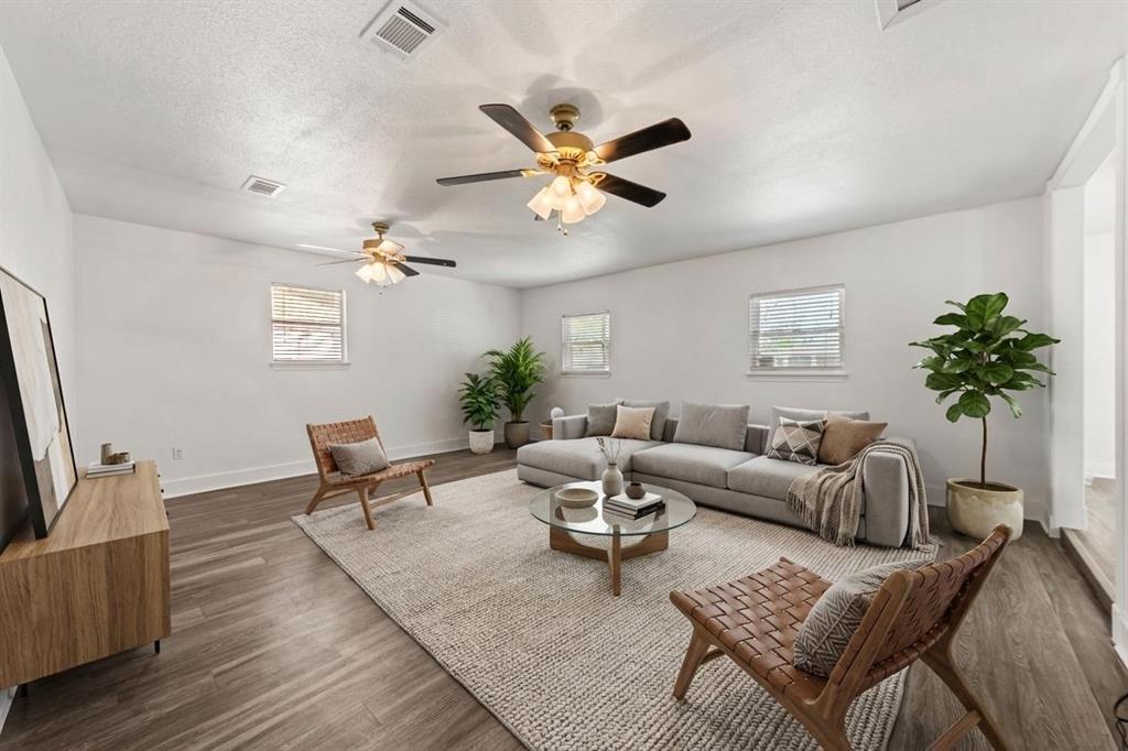 104 East Santa Anna Street Robinson, TX 76706 - Photo 21 of 36 a living room with furniture and a potted plant