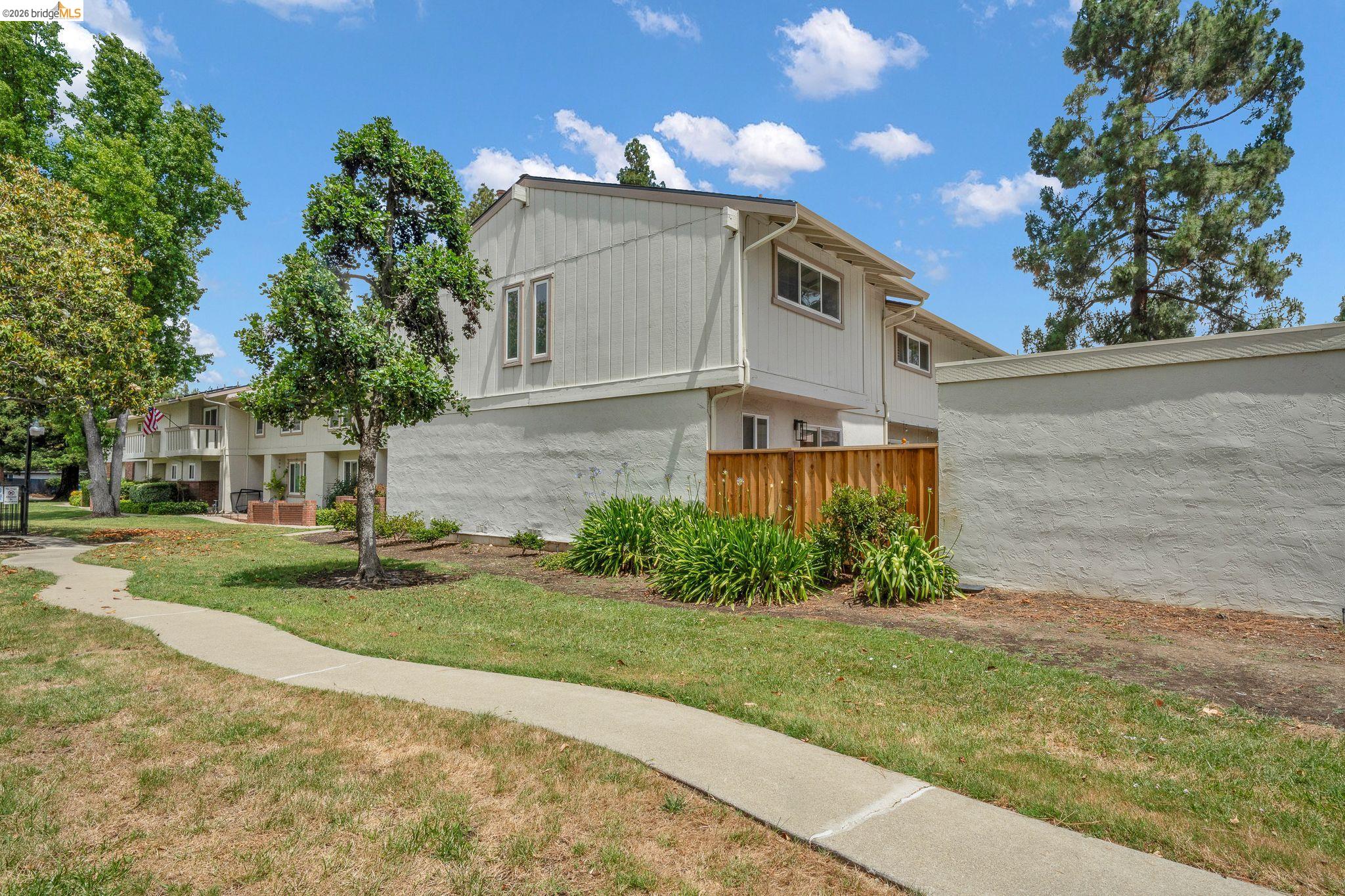 1808 Wildbrook Court, Unit D Concord, CA 94521 - Photo 44 of 47 a front view of a house with a yard