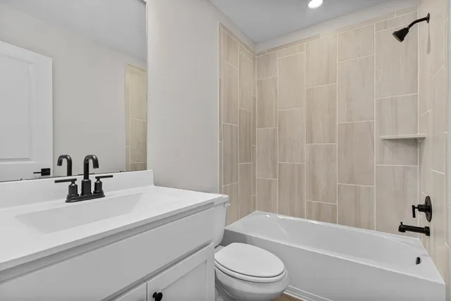 a bathroom with a sink a toilet and a bathtub