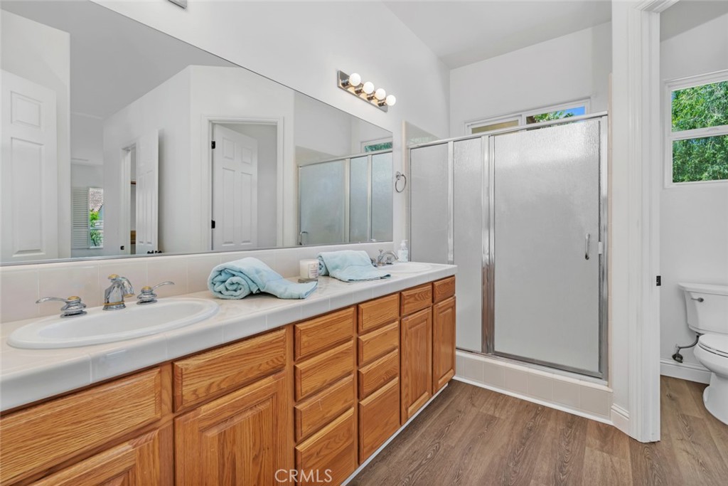 10102 Lace Cascade Court Bakersfield, CA 93311 - Photo 18 of 34 Primary Bathroom with large walk-in shower and dual sink vanity