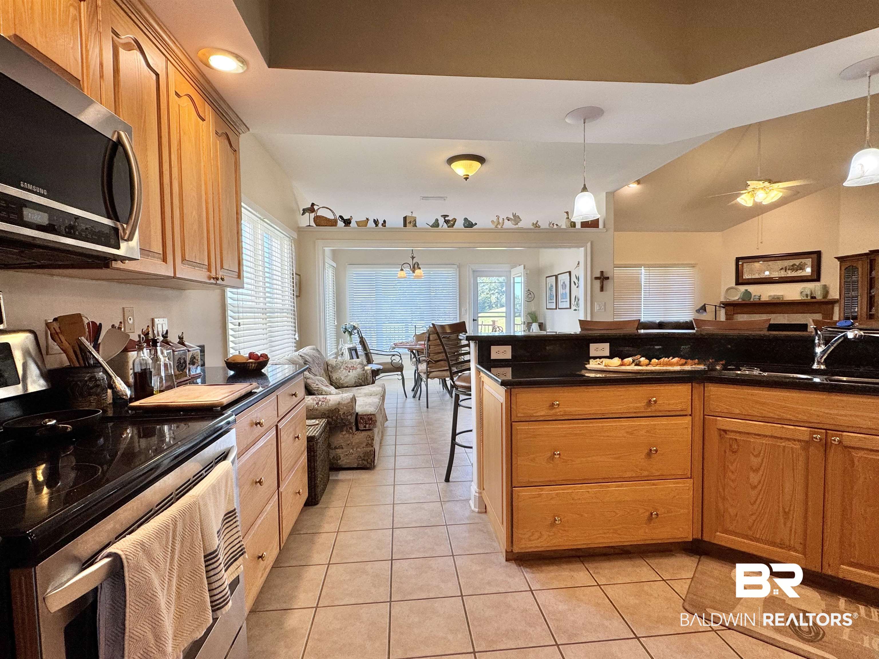 22415 Inverness Way Foley, AL 36535 - Photo 7 of 34 Kitchen with pendant lighting, sink, light tile patterned flooring, and appliances with stainless steel finishes
