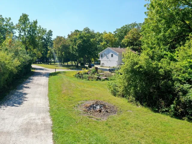 a swimming pool with trees in the background