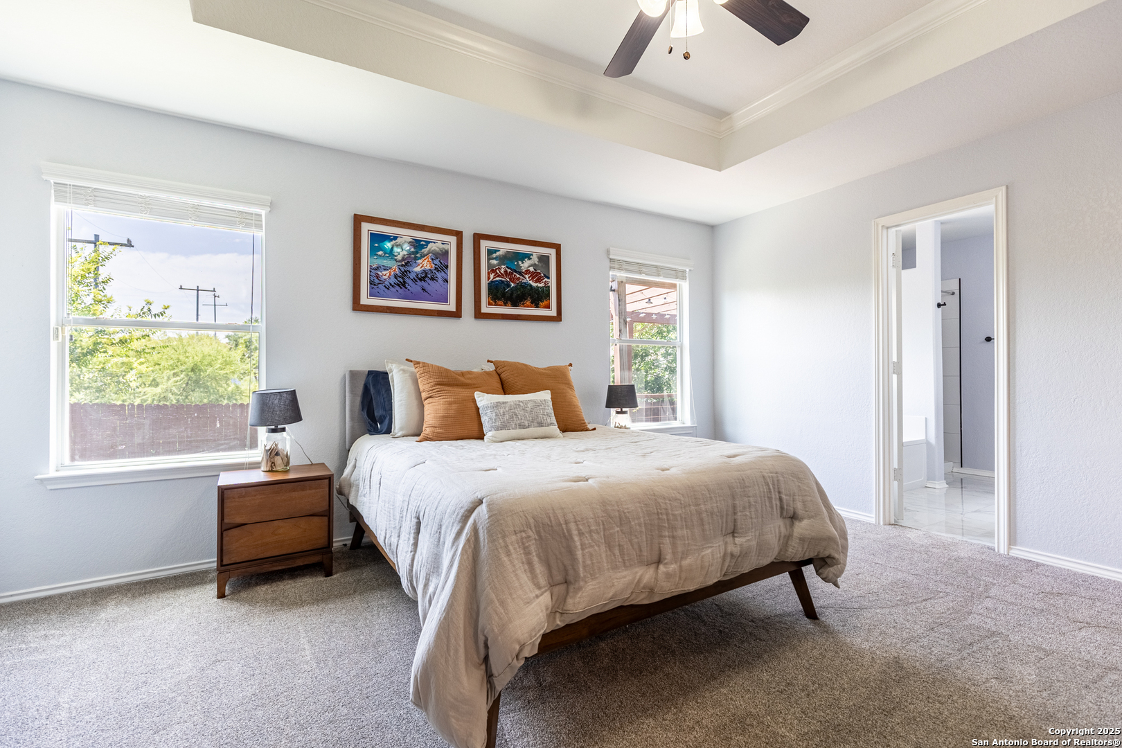 9518 Lookover Bay Converse, TX 78109 - Photo 16 of 30 a bedroom with a bed and a painting on the wall