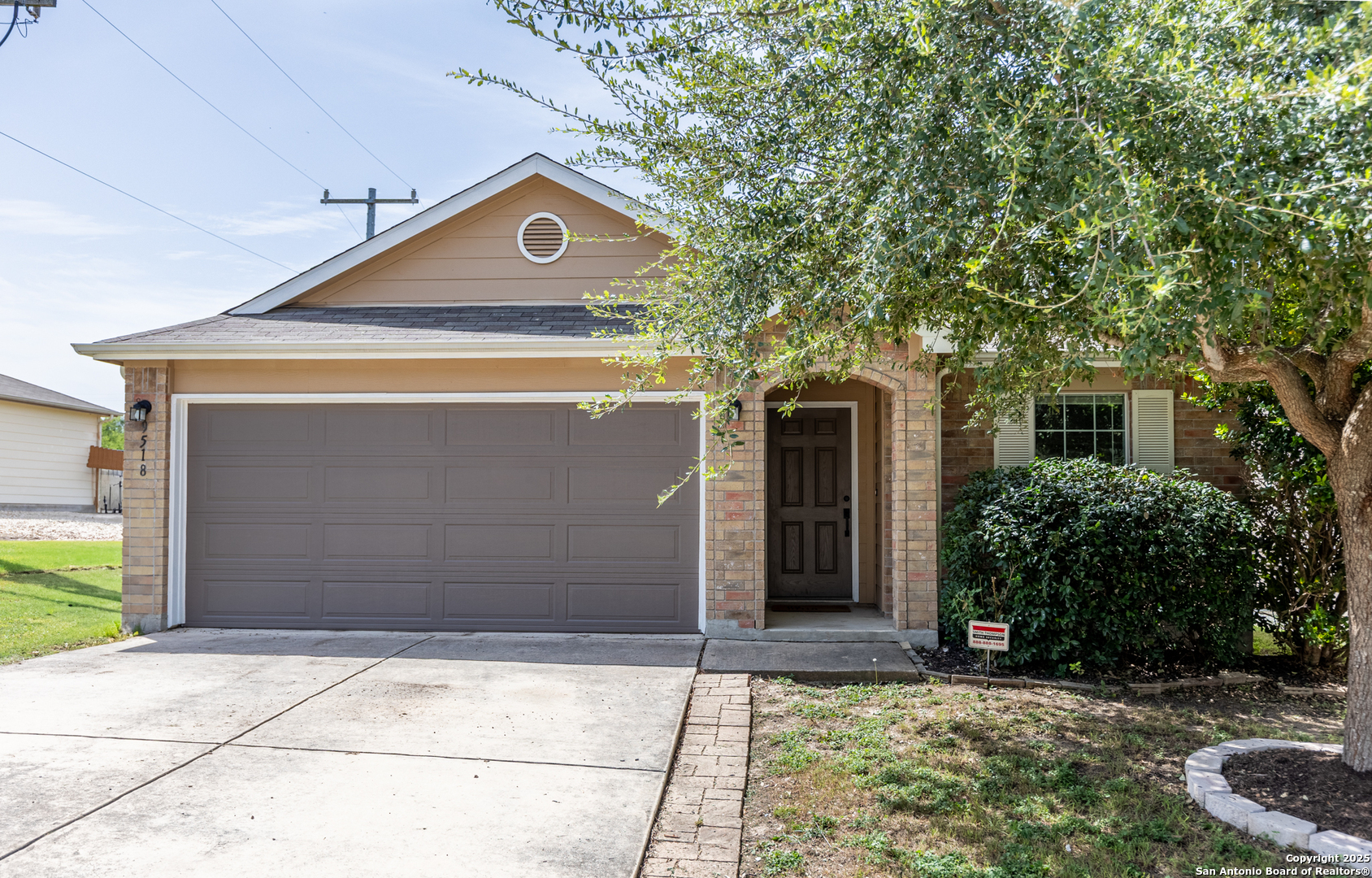 9518 Lookover Bay Converse, TX 78109 - Photo 2 of 30 a front view of a house with garden