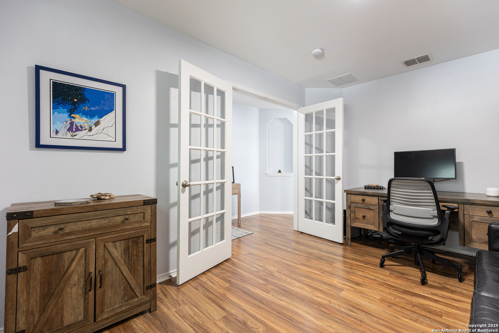 9518 Lookover Bay Converse, TX 78109 - Photo 28 of 30 a view of a workspace with furniture and wooden floor