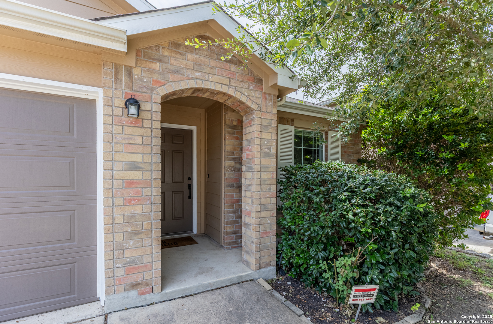 9518 Lookover Bay Converse, TX 78109 - Photo 4 of 30 a front view of a house with plants