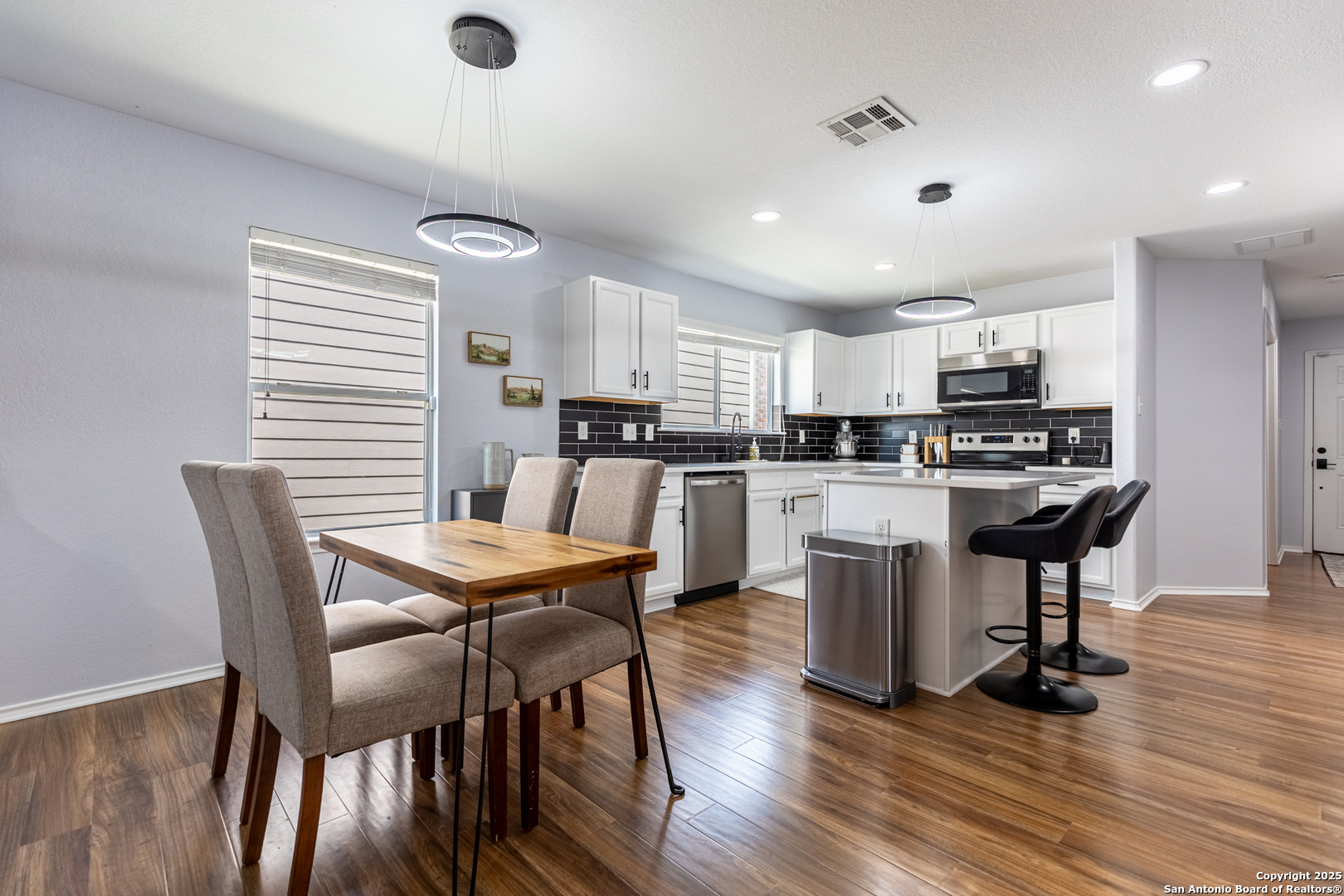 9518 Lookover Bay Converse, TX 78109 - Photo 8 of 30 a view of a dining room with furniture and wooden floor