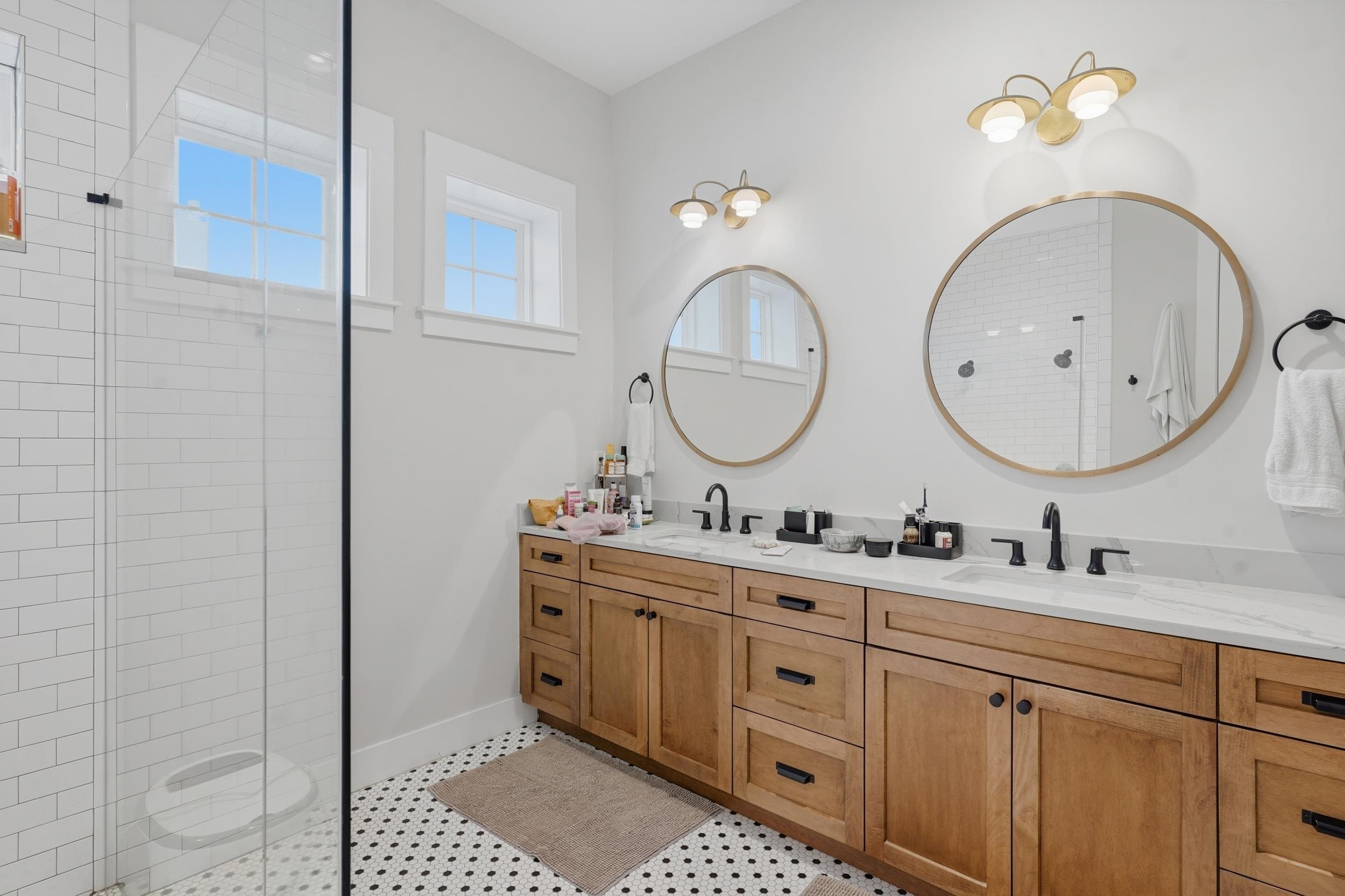 240 Ridgeway Road St. Augustine, FL 32080 - Photo 30 of 38 Full bathroom featuring double vanity, healthy amount of natural light, and tiled shower