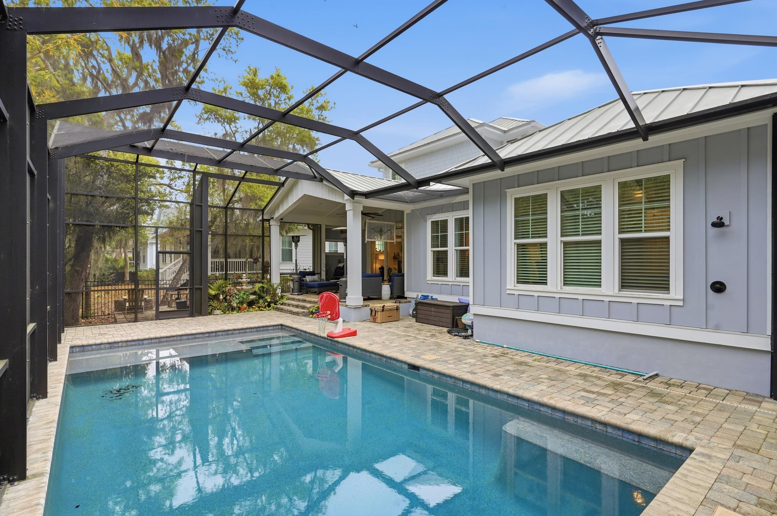 240 Ridgeway Road St. Augustine, FL 32080 - Photo 5 of 38 Outdoor pool featuring glass enclosure, a sunroom, and a patio