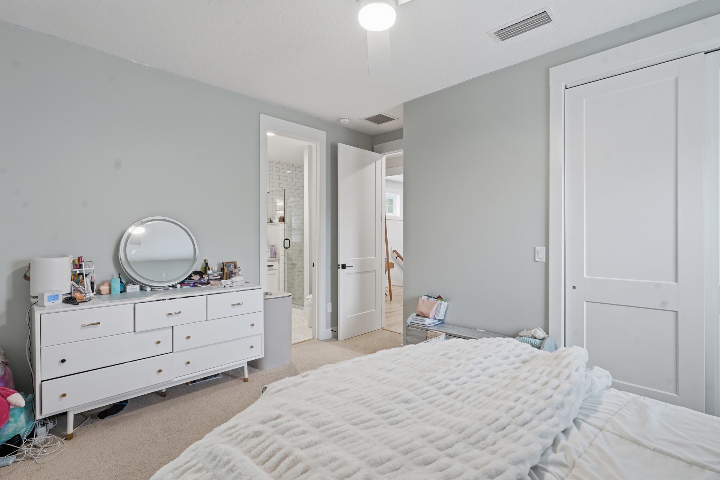 240 Ridgeway Road St. Augustine, FL 32080 - Photo 8 of 38 Bedroom with light carpet, ceiling fan, and a closet