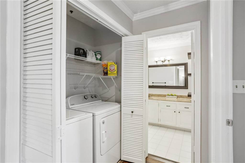 970 Sidney Marcus Boulevard Northeast, Unit 2115 Atlanta, GA 30324 - Photo 11 of 21 a utility room with dryer and washer