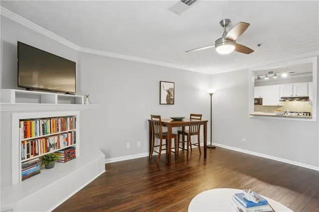 a view of a livingroom with furniture and a flat screen tv