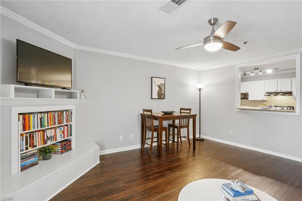 970 Sidney Marcus Boulevard Northeast, Unit 2115 Atlanta, GA 30324 - Photo 5 of 21 a view of a livingroom with furniture and a flat screen tv