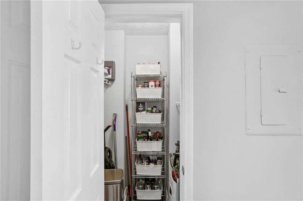 970 Sidney Marcus Boulevard Northeast, Unit 2115 Atlanta, GA 30324 - Photo 10 of 21 a picture of a room with table and closet