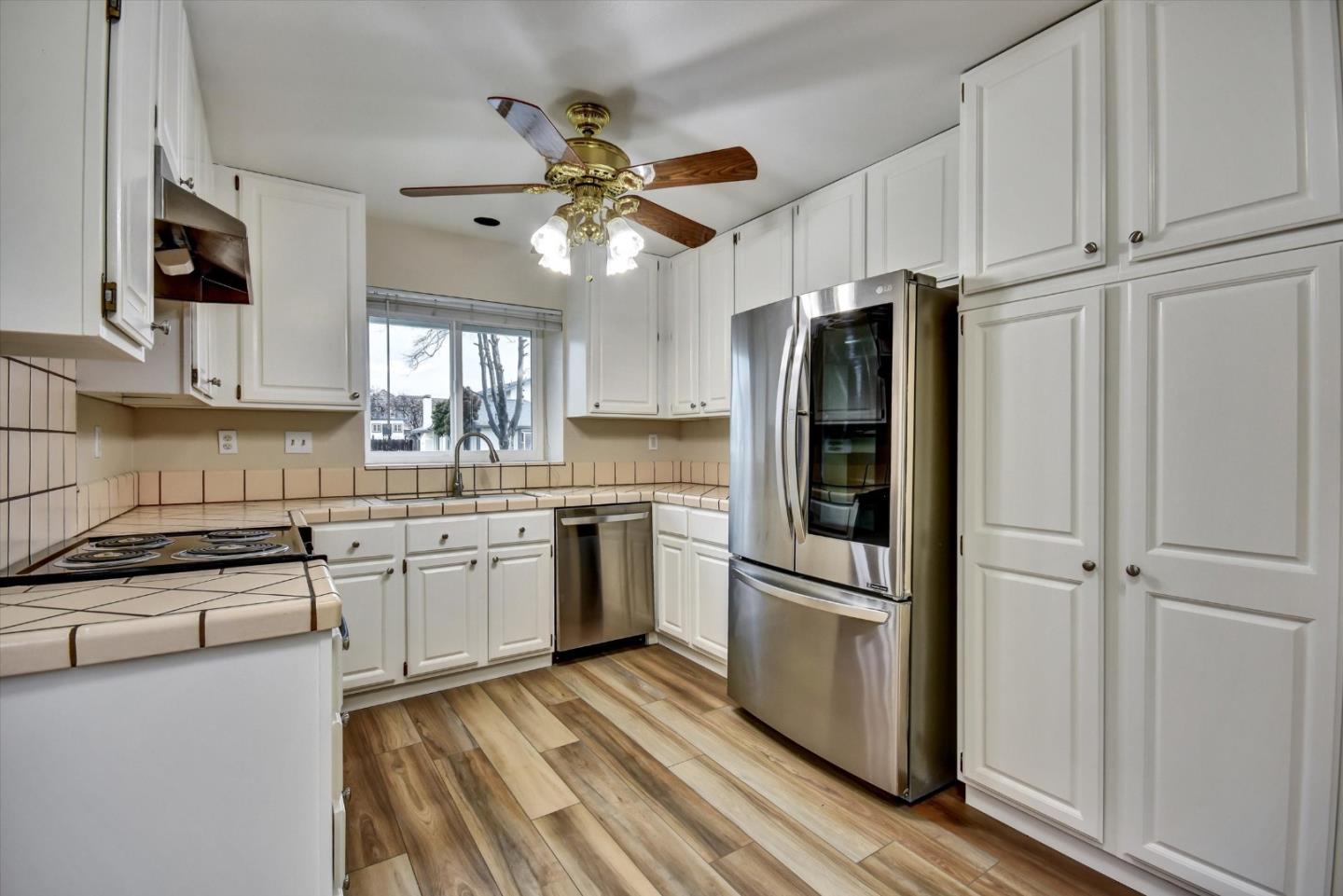 420 Brighton Street Salinas, CA 93907 - Photo 12 of 41 a kitchen with granite countertop stainless steel appliances cabinets a sink and a window