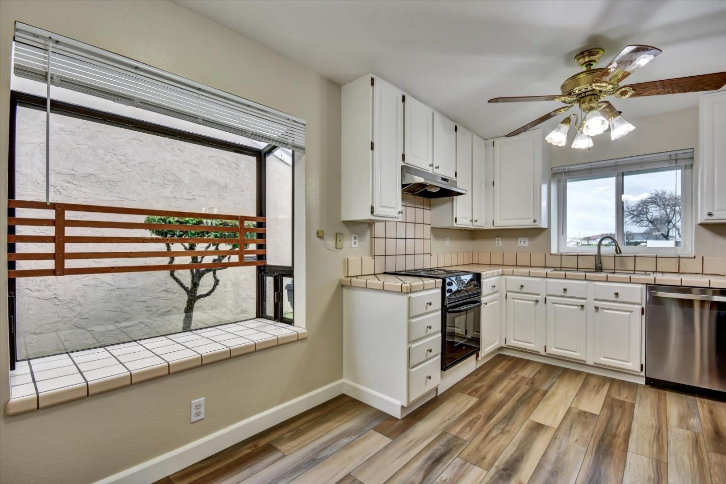 420 Brighton Street Salinas, CA 93907 - Photo 13 of 41 a kitchen with stainless steel appliances granite countertop a sink a stove and cabinets