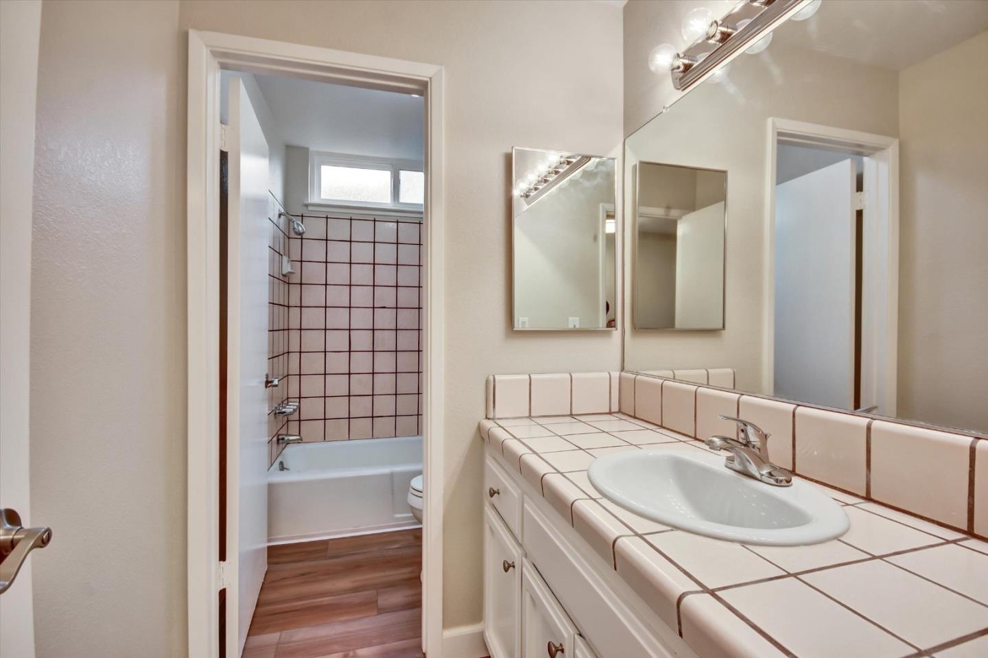 420 Brighton Street Salinas, CA 93907 - Photo 23 of 41 a bathroom with a sink and a mirror