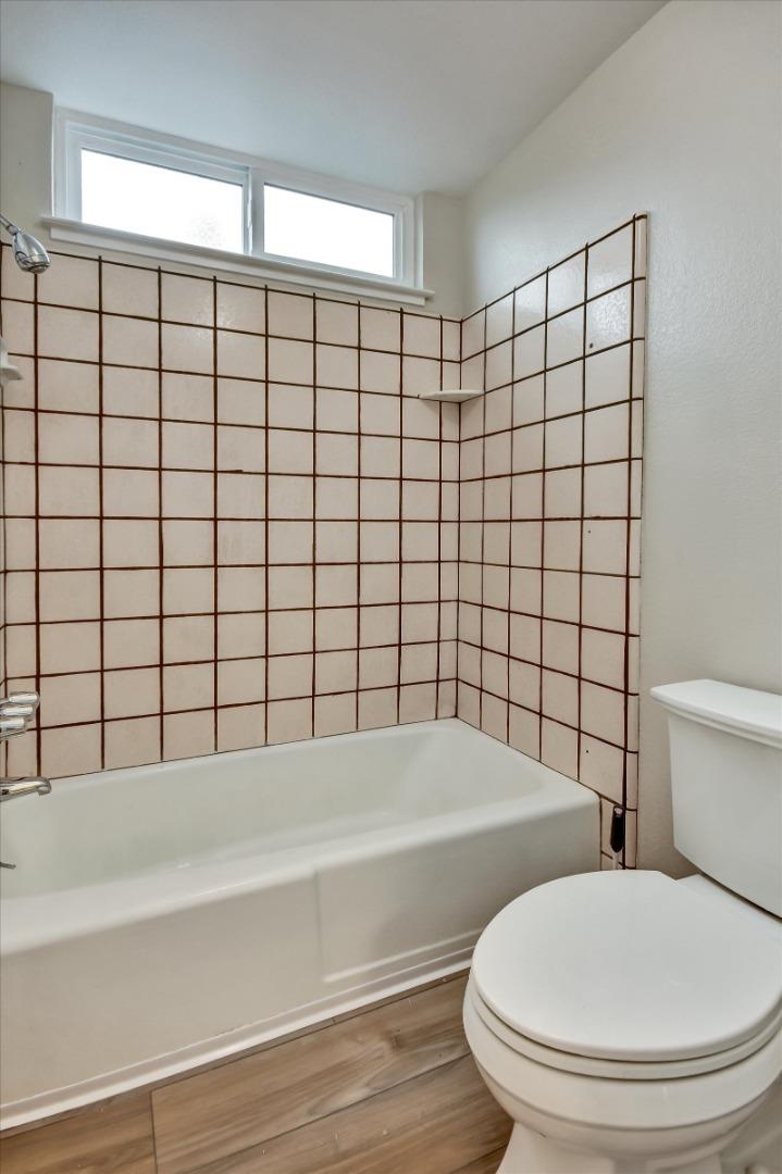 420 Brighton Street Salinas, CA 93907 - Photo 24 of 41 a bathroom with a bathtub and a toilet