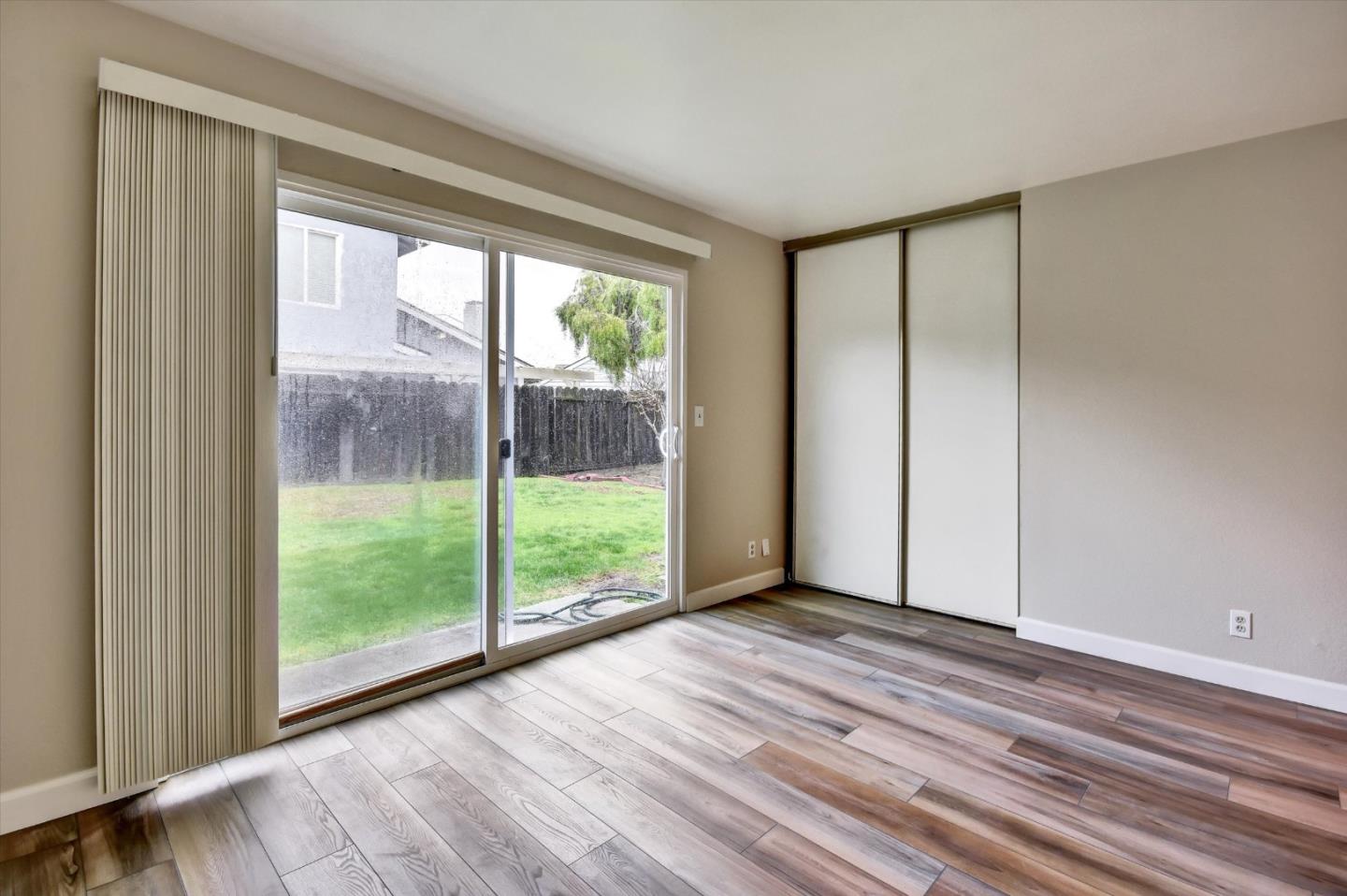 420 Brighton Street Salinas, CA 93907 - Photo 26 of 41 a view of an empty room with wooden floor and a window