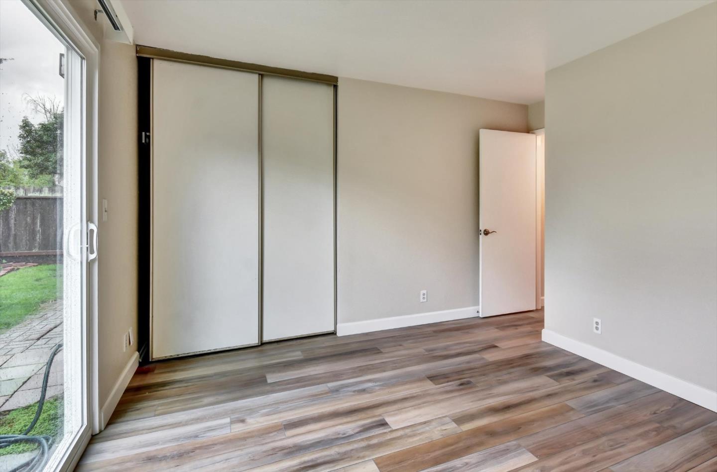 420 Brighton Street Salinas, CA 93907 - Photo 27 of 41 a view of an empty room with wooden floor and a window