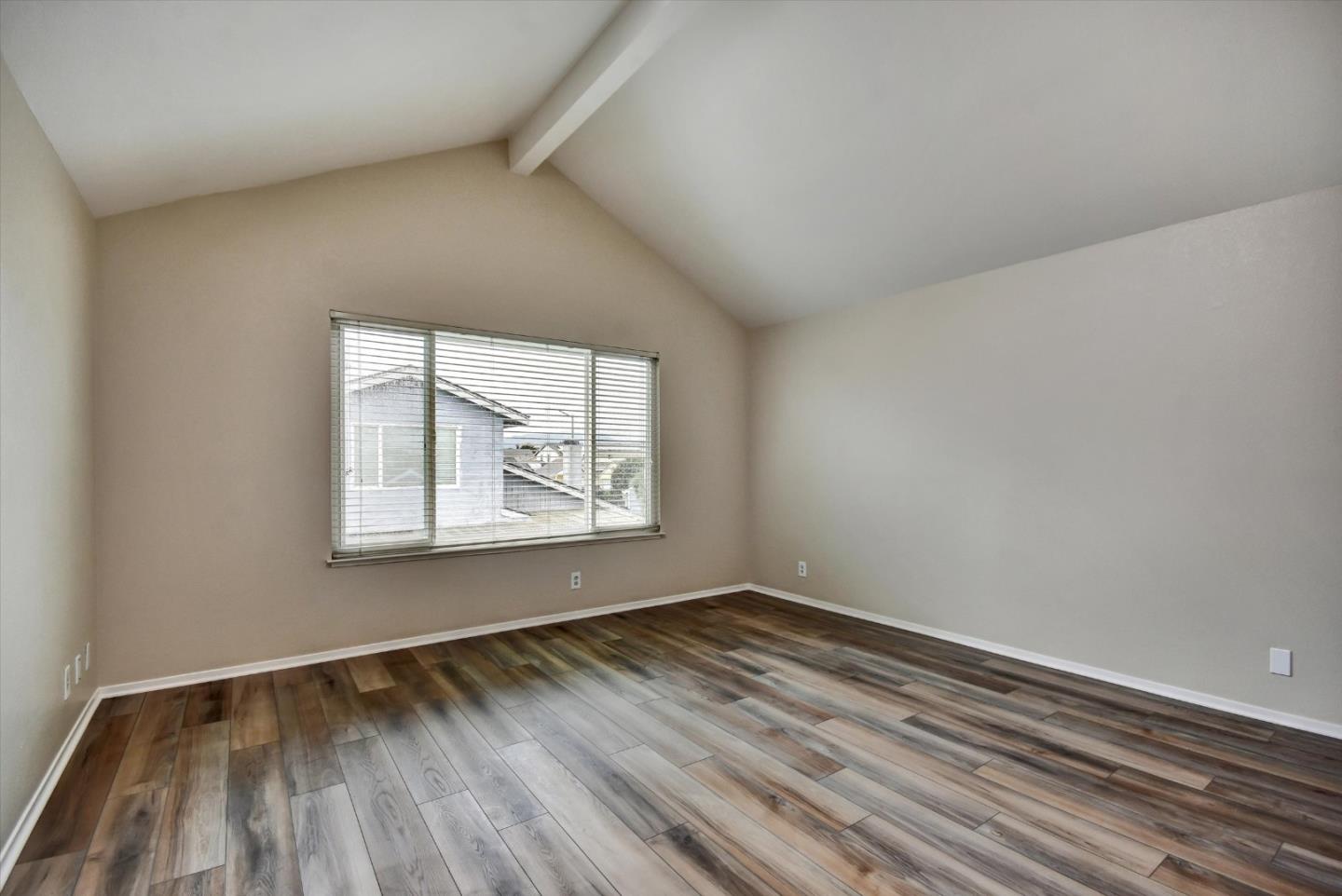 420 Brighton Street Salinas, CA 93907 - Photo 29 of 41 an empty room with wooden floor and windows