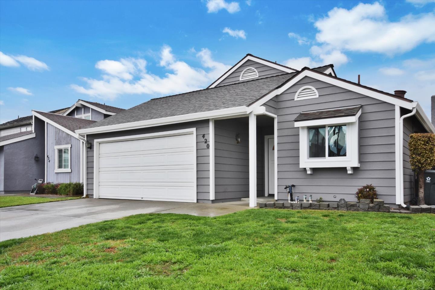 420 Brighton Street Salinas, CA 93907 - Photo 3 of 41 a front view of a house with a garden