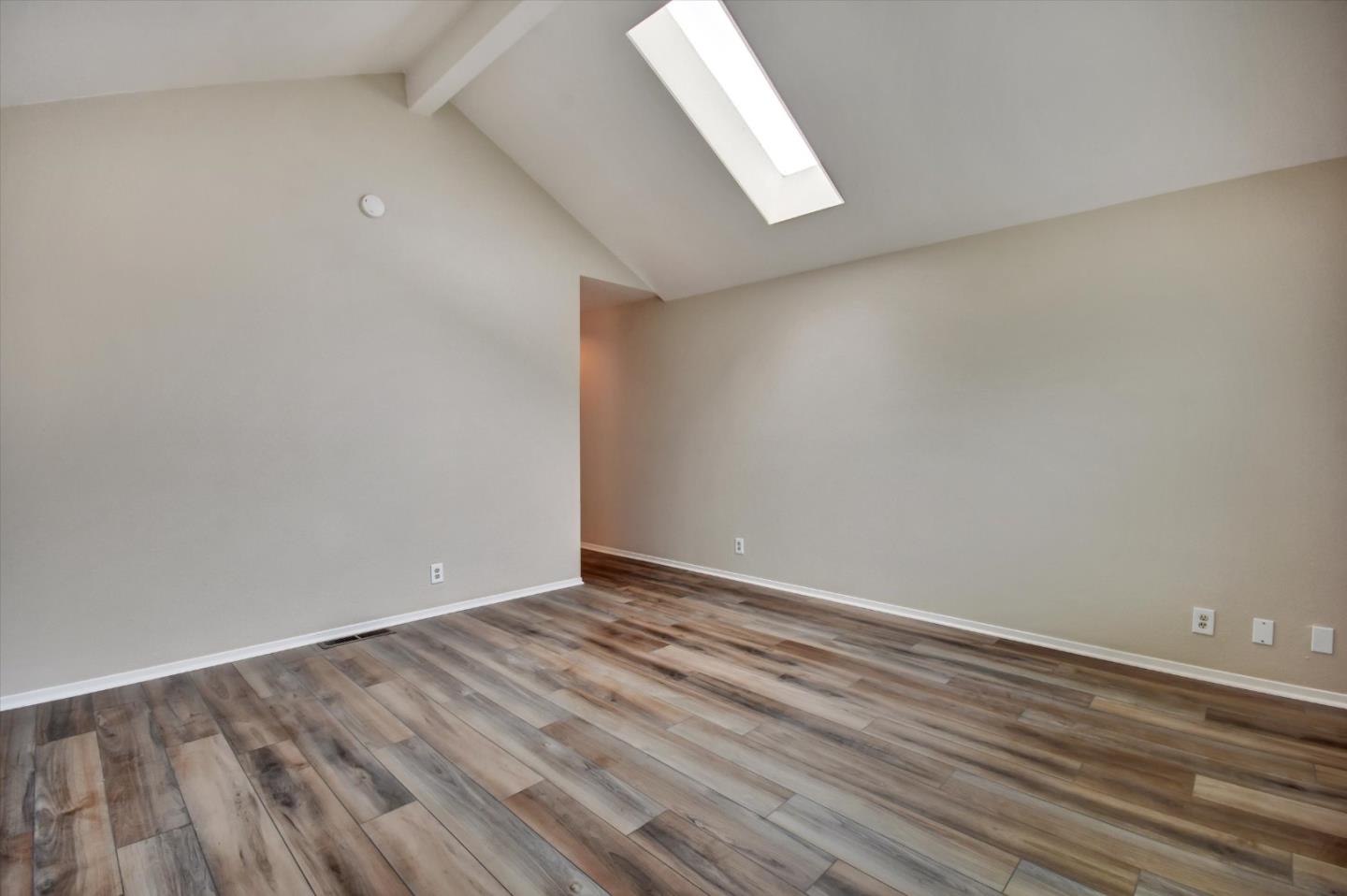 420 Brighton Street Salinas, CA 93907 - Photo 32 of 41 a view of an empty room with wooden floor and a window