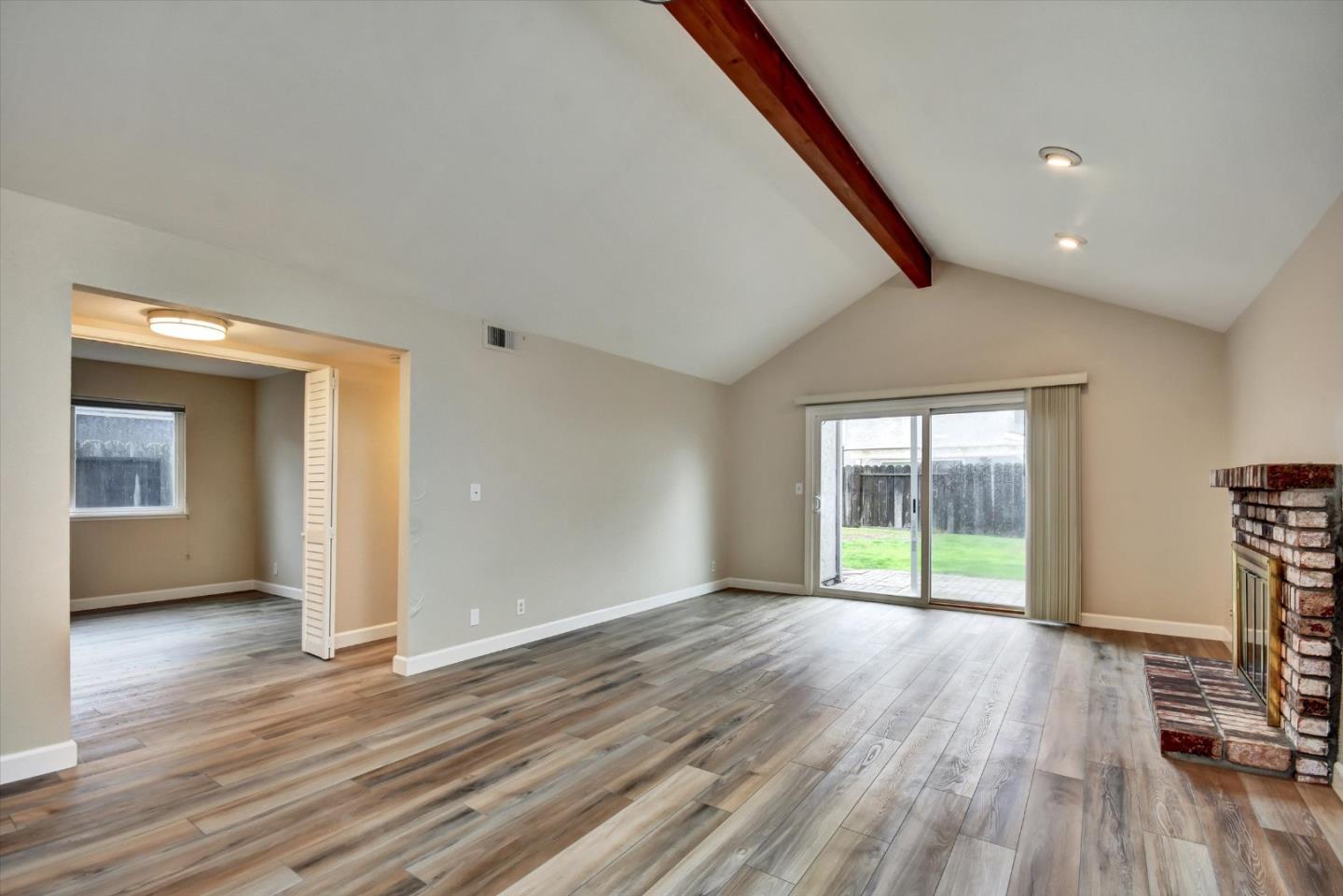 420 Brighton Street Salinas, CA 93907 - Photo 4 of 41 wooden floor in an empty room with a window
