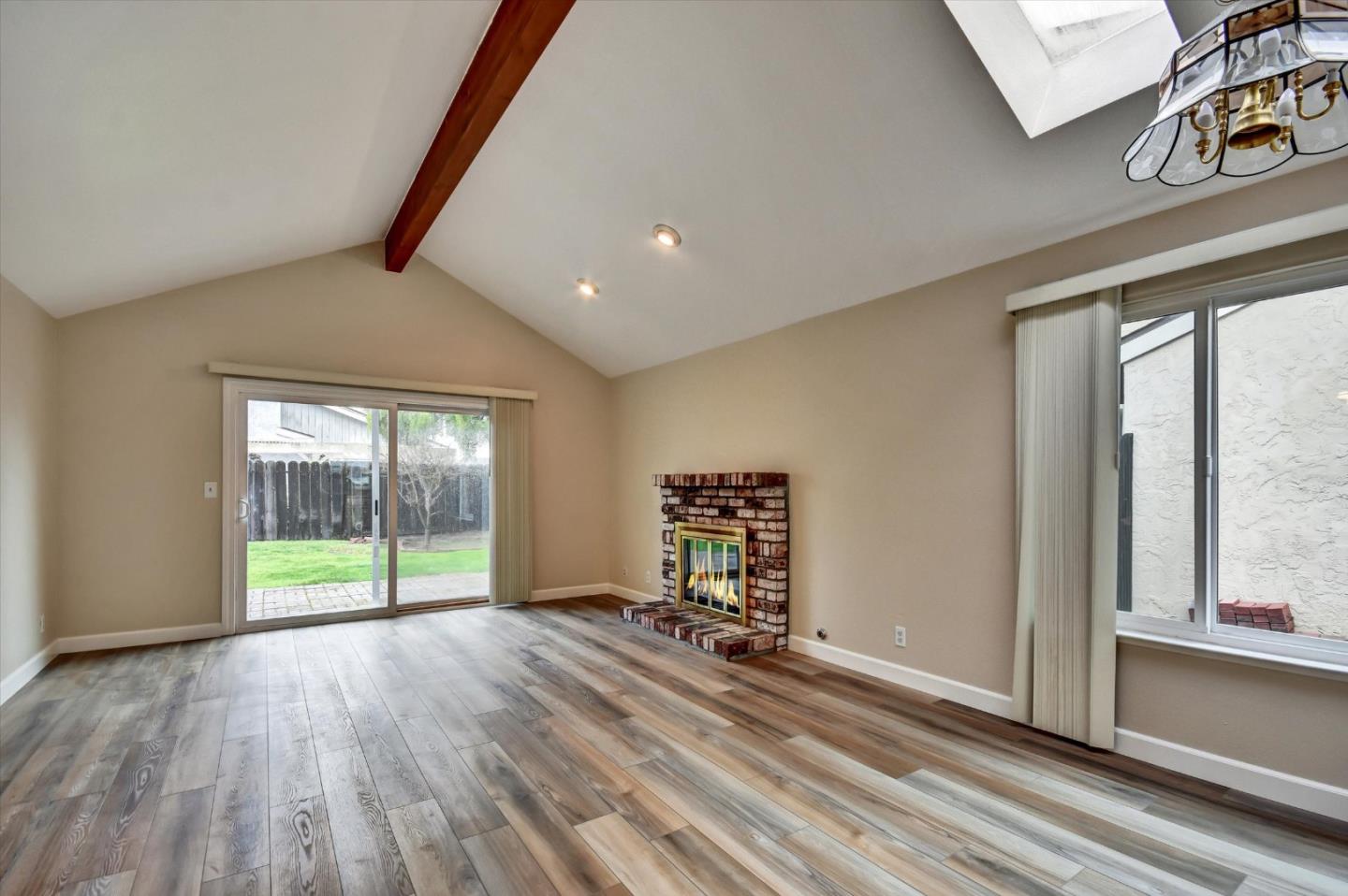 420 Brighton Street Salinas, CA 93907 - Photo 5 of 41 a view of an empty room with wooden floor and a window