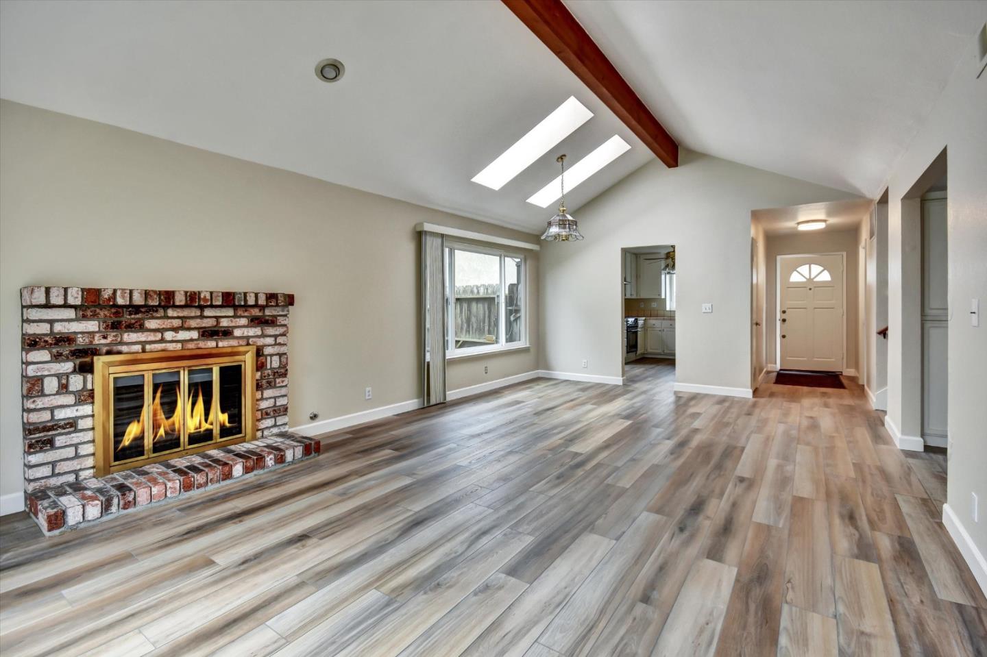 420 Brighton Street Salinas, CA 93907 - Photo 8 of 41 wooden floor in an empty room with a fireplace